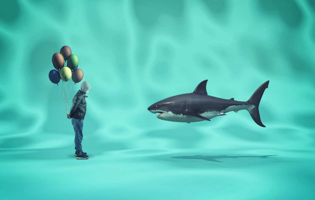 Shark and a boy with colored balloons